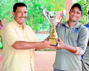 Nations Trust Bank skipper receives the Challenge Cup from Lester Hannibal, President of the MSCA.