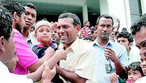 Former Maldives president Mohamed Nasheed (C) greets people after Friday prayers  (AFP)