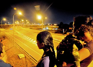 Expressway by night: Public enjoy a walk on the highway before its official opening. Pic by Mangala Weerasekera