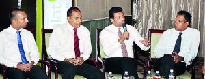 The three speakers with  STBC  president Chaturanga Perera