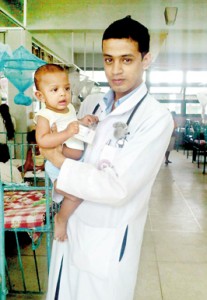 Chamara with a tiny patient during his  clinicals in the  Paediatric Ward,  Peradeniya Hospital