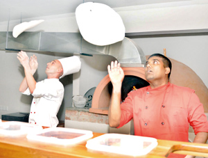 Chef Capodiferro and assistant demonstrate their pizza-making skills and below Antonio Ciocia. Pix by Ranjith Perera