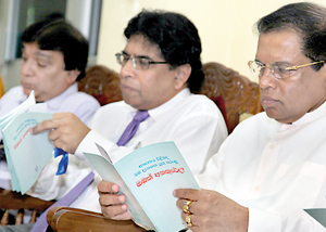 Health Minister Maithripala Sirisena, Health Ministry Secretary Dr. Nihal Jayathilaka and Colombo North Teaching Hospital Director Dr. Roy Perera perusing the booklet on Stroke Facts