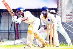 Bandaranayake College’s Dhananjaya Vithana drives vs Ananda   - Pic by Ranjith Perera