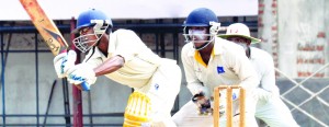 Bandaranayake College’s Dhananjaya Vithana drives vs Ananda   - Pic by Ranjith Perera