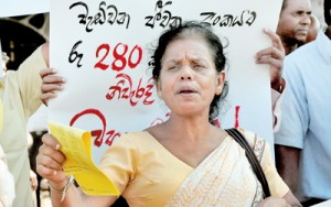 A protest in front of the Fort Railway Station on Thursday against rising cost of living. Pix by Mangala Weerasekera