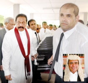 President Rajapaksa carrying the coffin of his close friend C.R.De Silva  yesterday. (Inset: C.R.De Silva)  Pic by Ranjith Perera