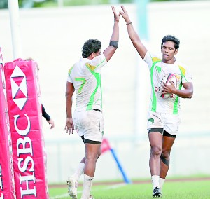 Sri Lanka skipper Fazil Marija (R) shares a high-five with team-mate Sandun Herath after beating Philippines - Pic SLRFU