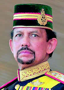 Brunei's Sultan Hassanal Bolkiah stands during his 64th birthday celebrations in Bandar Seri Begawan
