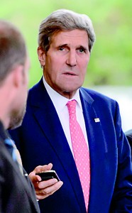 US Secretary of State John Kerry looks on upon arrival in Geneva on November 8, 2013 on the second day of talks with Iran on the country's nuclear programme. AFP