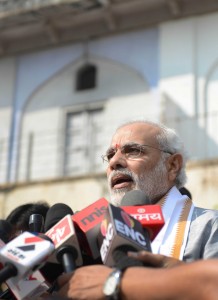 Gujarat Chief Minister and Bharatiya Janata Party (BJP) prime ministerial candidate Narendra Modi (C) speaks to the media. AFP
