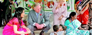 Britain's Prince Charles (2nd L) and his wife Camilla, Duchess of Cornwall, interact with children inside a room at a Mobile Creche in Mumbai yesterday. Prince Charles and his wife Camilla, Duchess of Cornwall, are on a nine-day visit to India. REUTERS/Danish Siddiqui