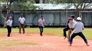 A batsman from the winning team pulls one over the rope in the final
