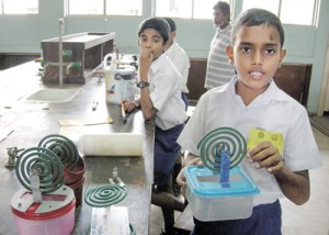 Kavindu Rasanjana with his invention. Pix: Athula Devapriya