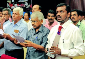 Merit winners: Sarath Nandalal of the Rakshana Sewaka Sangamaya (RSS)  (representing the union that won) (second from right) and Saman Ratnapriya (right). Below: Justice C.G. Weeramantry.Pix by Amila Gamage.