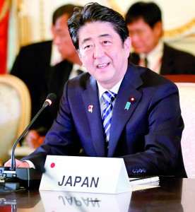Japan's Prime Minister Shinzo Abe speaks during the first session of ASEAN-Japan Commemorative Summit Meeting at the state guest house in Tokyo on December 14, 2013.  Japan pledged 20 billion USD in aid and loans to Southeast Asia, in its latest charm offensive to woo global public opinion in a territorial dispute with China.   AFP