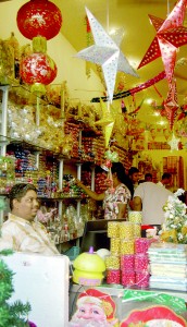 These businessmen in Pettah (above and top ) are hopeful that their  sales will rise in coming weeks. Pix by Nilan Maligaspe