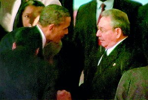 US President Barack Obama (L) shakes hands with Cuban President Raul Castro in this still image taken from a video courtesy of the South Africa Broadcasting Corporation. Reuters