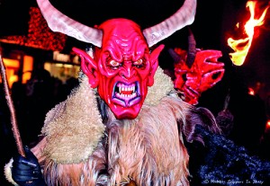 In Austria, children live in fear of Krampus, a Christmas devil who's said to beat naughty children with branches (©CC BY-ND 2.0 'Red-faced Krampus' by  Rubber Slippers In Italy)
