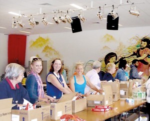Much thought behind them: Volunteers take on the task of packing Christmas hampers