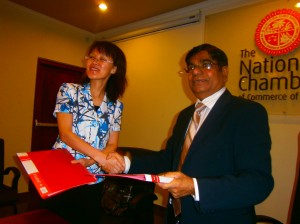 Ms. Wu Lixia, Vice Chairman, CCPIT, Gansu is seen exchanging the signed MOU with Thilak Godamanna, Senior Deputy President –NCCSL.