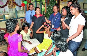 Nilantha Bastian, Head of Retail Banking & Wealth Management with staff volunteers at the Sri Sangamiththa Balika Niwasaya in Kohuwela copy