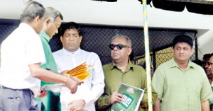 UNP General Secretary Tissa Attanayake hands over appointment letters to Ravi Karunanayake and Mangala Samaraweera, who are members of the party’s newly appointed Leadership Council, as Sajith Premadasa who has not accepted his nomination to the council looks on. Pix by Susantha Liyanawatte