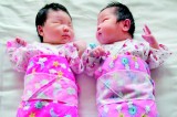 China eases one-child policy, abolishes labour camps