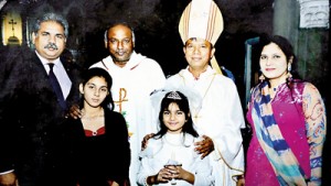 Back home: Irfan and family with Lahore’s Archbishop  and Vicar General