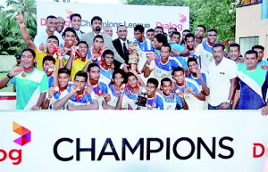 Dialog Axiata officials Trinesh Fernando and Harsha Samaranayake present the Dialog Champions League 2013 trophy to Air Force skipper Harsha Fernando watched by FFSL officials Ranjith Rodrigo, Upali Hewage and R. Puvanandiran and the victorious Air Force team