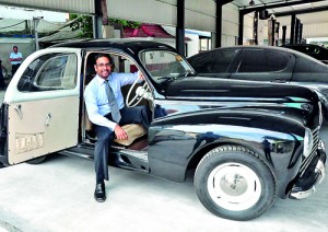 Yasendra in a well maintained old Peugeot