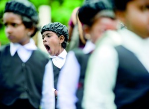 A long day: A child struggles with boredom at a school event in the North