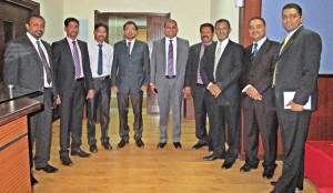 Commercial Bank representatives with Al Ahalia management.