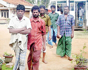 Indian fishermen arrested by the Navy on Thursday being brought to the Kalpitiya Police station.  Pic by Padma Kumari Kankanamge