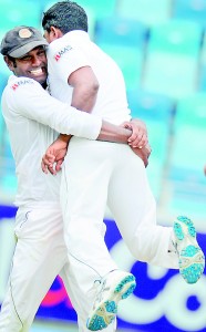 Sri Lanka captain Angelo Mathews and bowler Rangana Herath celebrates