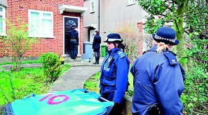 Probe: Officers were called to the property in north-west London at 5pm yesterday evening. A woman and her two sons were found dead