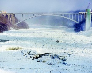 In the incredible pictures, the Rainbow Bridge is seen with solid ice below it. Reuters