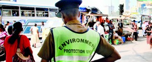 Environment policemen use the few noise detecting machines they have to check bigger vehicles
