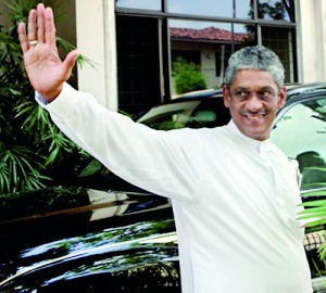 Sarath Fonseka leaving the Elections Commisioner’s office after lodging  a complaint that his campiagn was being disrupted. Pix by Indika Handuwala