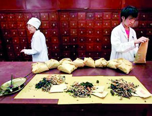 Workers prepare traditional Chinese herbal medicines at Beijing's Capital Medical University Traditional Chinese Medicine Hospital (Reuters)