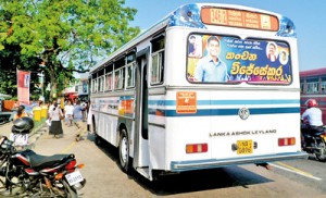 Smiling faces of candidates defacing buses and violating election laws