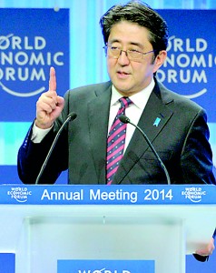 Japanese Prime Minister Shinzo Abe delivers his address during the opening session of the World Economic Forum in Davos  (AFP)