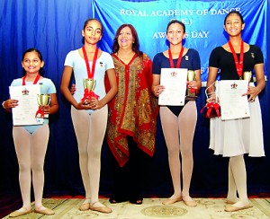 From L-R:  Junior School Award  – Nimara Mahawatte, Middle School Award – Chirathma W. De Silva, Principal – Mrs. Deanna Jayasuriya, Senior School Award (Tie) – Tamaia Dandeniya and Ravini Gunasekera