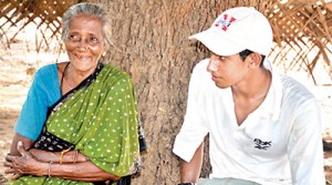 Committed to the cause:  Birendra Siriwardhana talks to a village elder