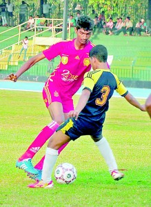 A Hameed Al-Husseinia striker attempts to run past a Royal defender 			- Pic by Mangala Weerasekara