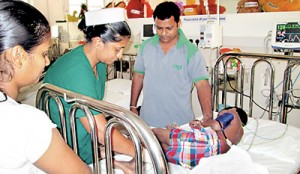 A child being treated for dengue at Negombo Hospital. Pic Hubert Fernando