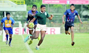 Try as they did, St. Sylvester’s College could do little to stall the storming Pathanians. - Pic by Amila Gamage.