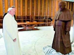 Another auction? The Pope was prestened with a chocolate version of himself made by amateur chocolatiers with 1.5 tons of cocoa from Atitlan in Guatemala which is a far cry from his humble meals of skinless chicken, fruit, and salad (AFP)