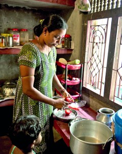 Bamini prepares a Jaffna dish in her kitchen