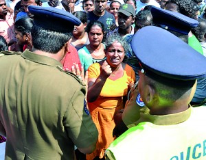 Angry residents take to the streets.                Pic by Susantha Liyanawatte